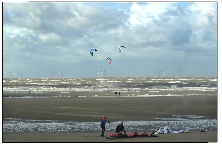 Wind surfers and beach