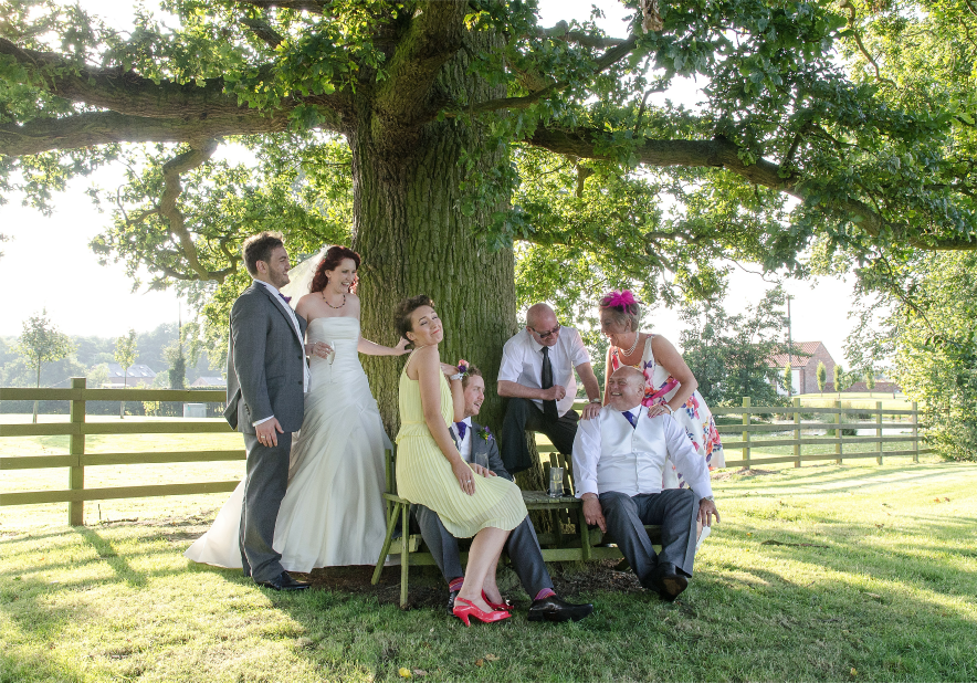 Wedding group under tree